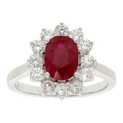 Oval Ruby and Star Halo Diamond Ring in 18K White Gold